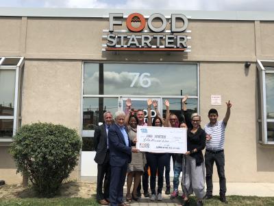 Fiera Foods team holding novelty cheque to Food Starter